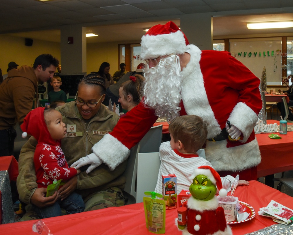 Members of the 117 ARW participate in holiday family event