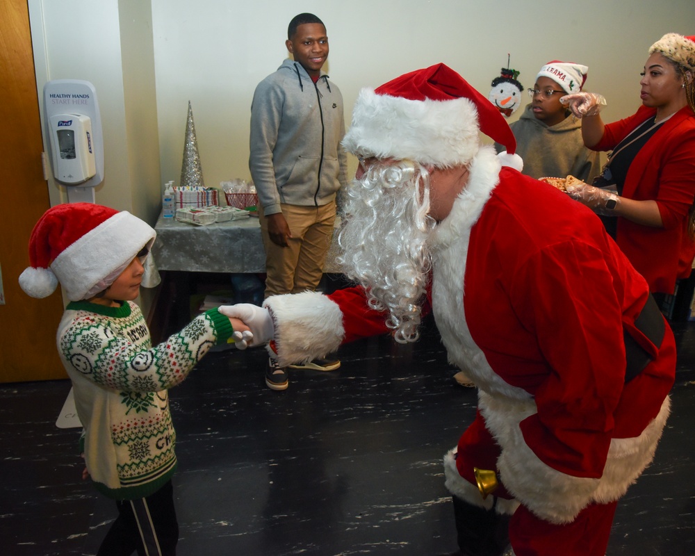 Members of the 117 ARW participate in holiday family event