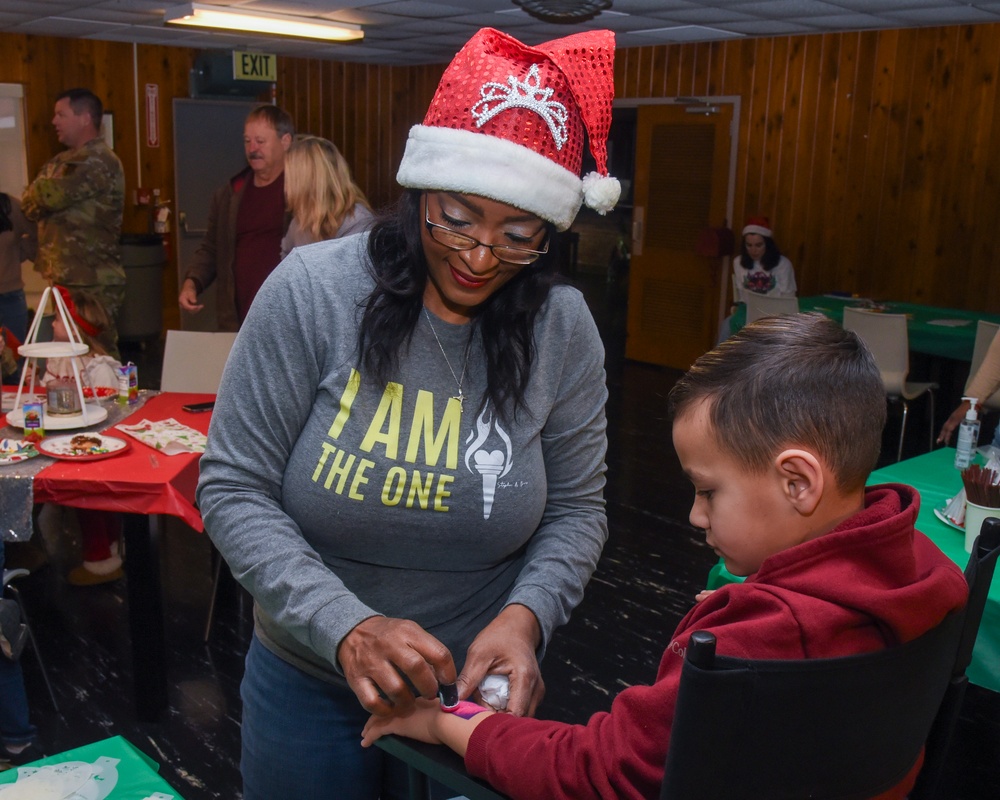 Members of the 117 ARW participate in holiday family event