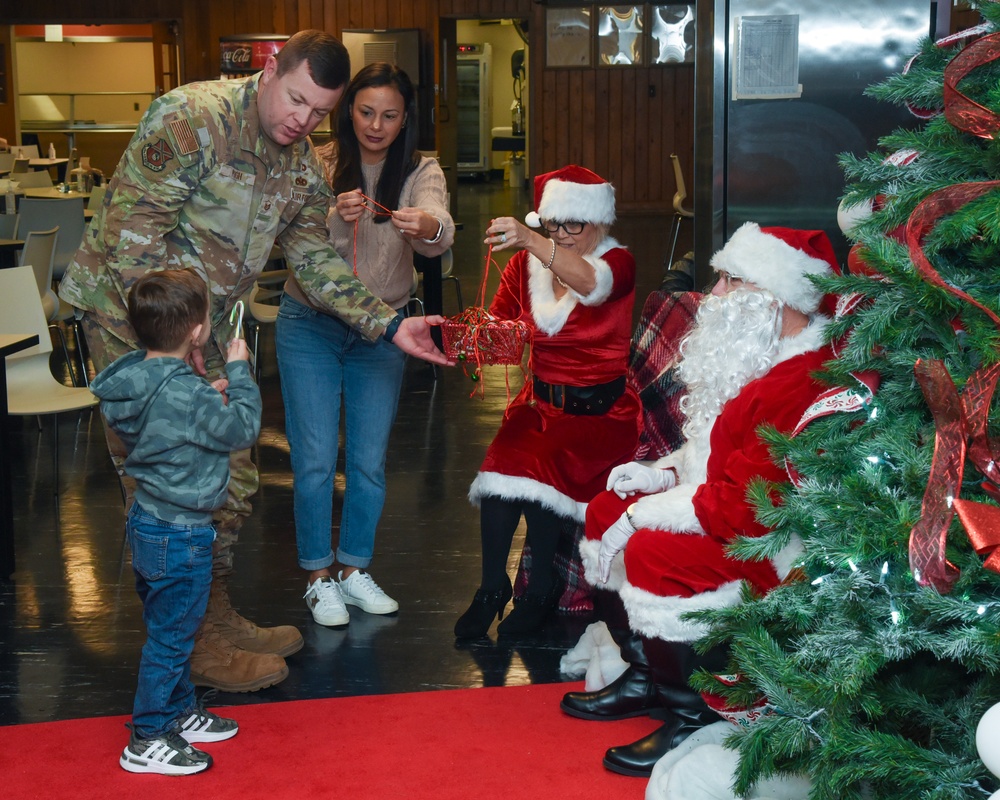 Members of the 117 ARW participate in holiday family event