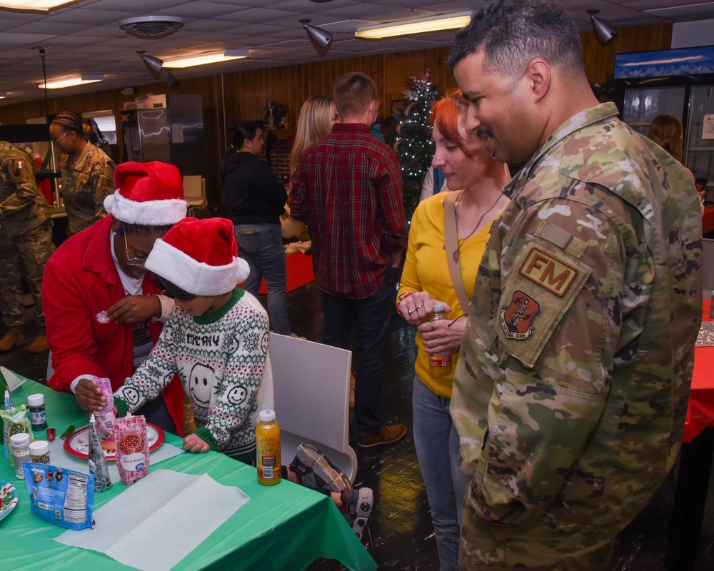 Members of the 117 ARW participate in holiday family event