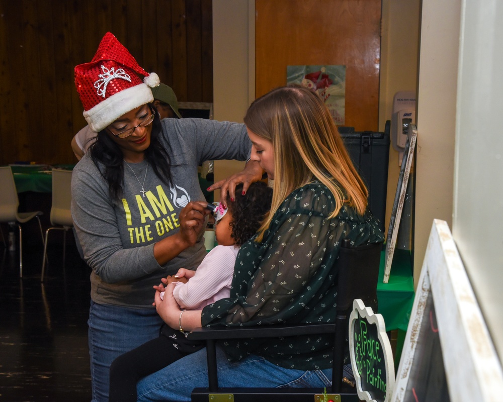 Members of the 117 ARW participate in holiday family event