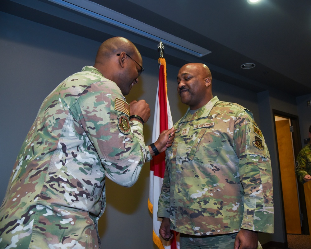 SMSGT Buford is promoted in a ceremony