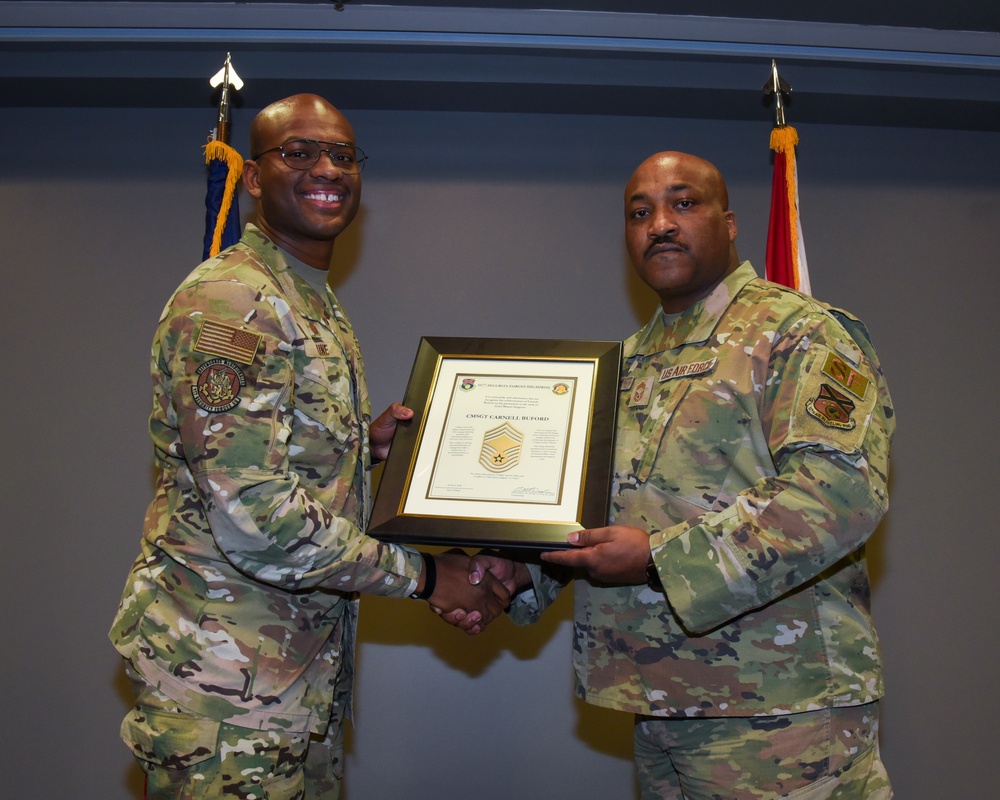 SMSGT Buford is promoted in a ceremony