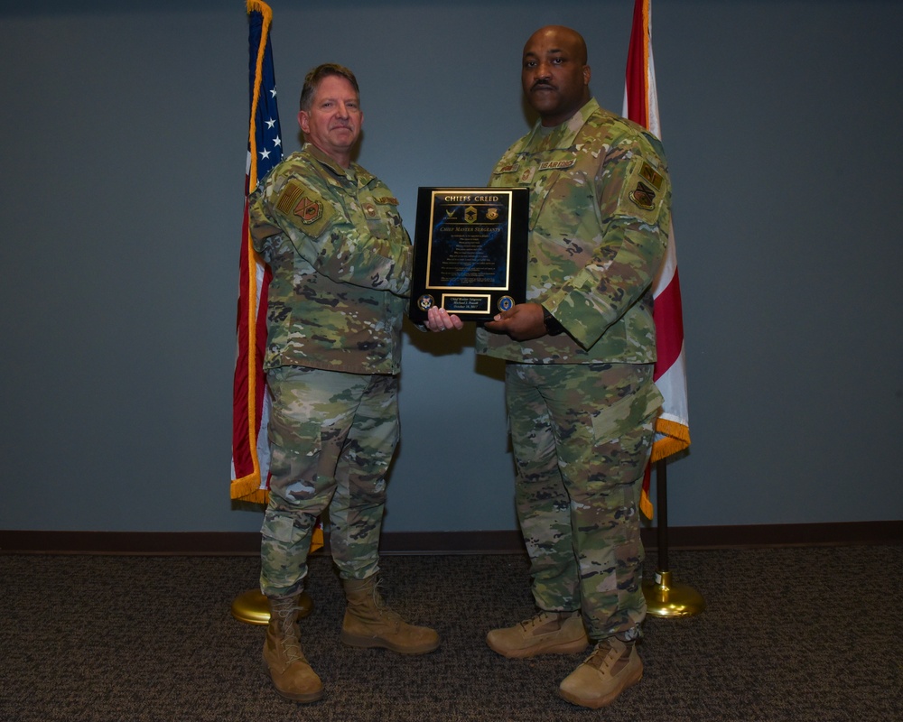 SMSGT Buford is promoted in a ceremony