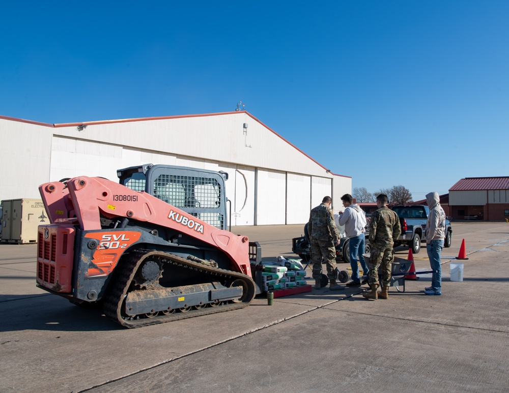 138th Civil Engineer Squadron Airmen fill flightline potholes