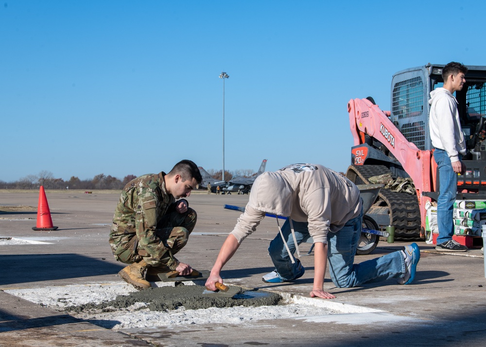 138th Civil Engineer Squadron Airmen fill flightline potholes