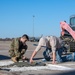 138th Civil Engineer Squadron Airmen fill flightline potholes