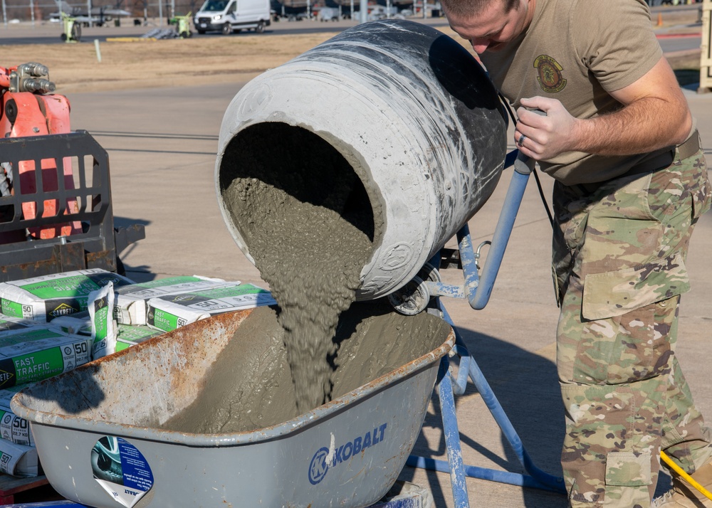 138th Civil Engineer Squadron Airmen fill flightline potholes