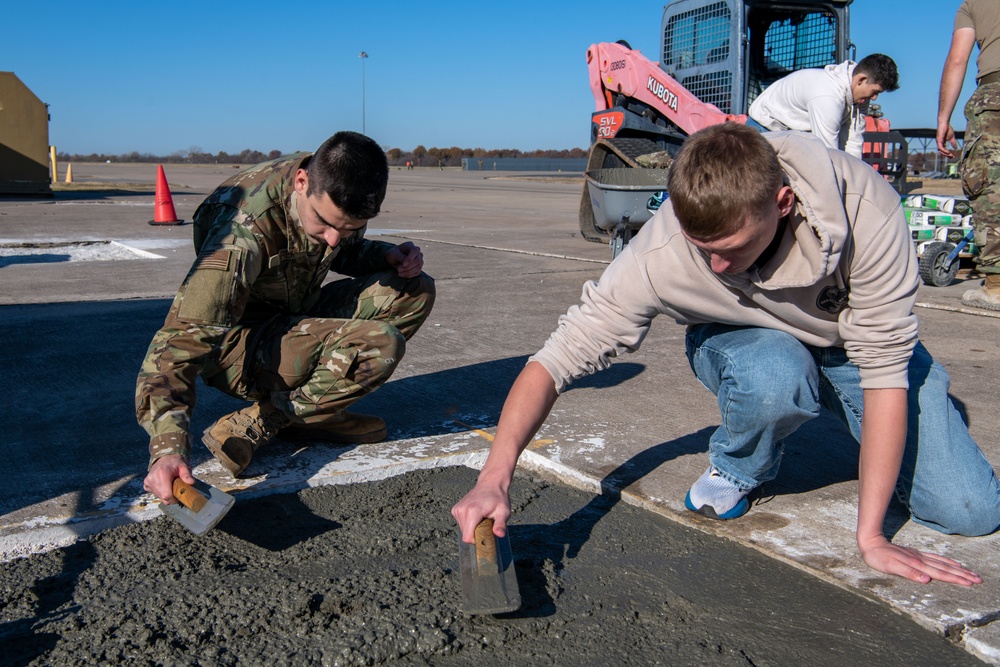 138th Civil Engineer Squadron Airmen fill flightline potholes