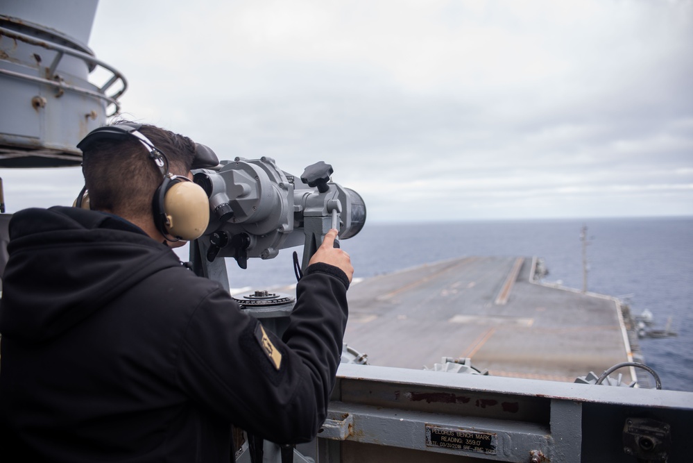 USS Ronald Reagan (CVN 76) Sailors navigate from the pilot house.