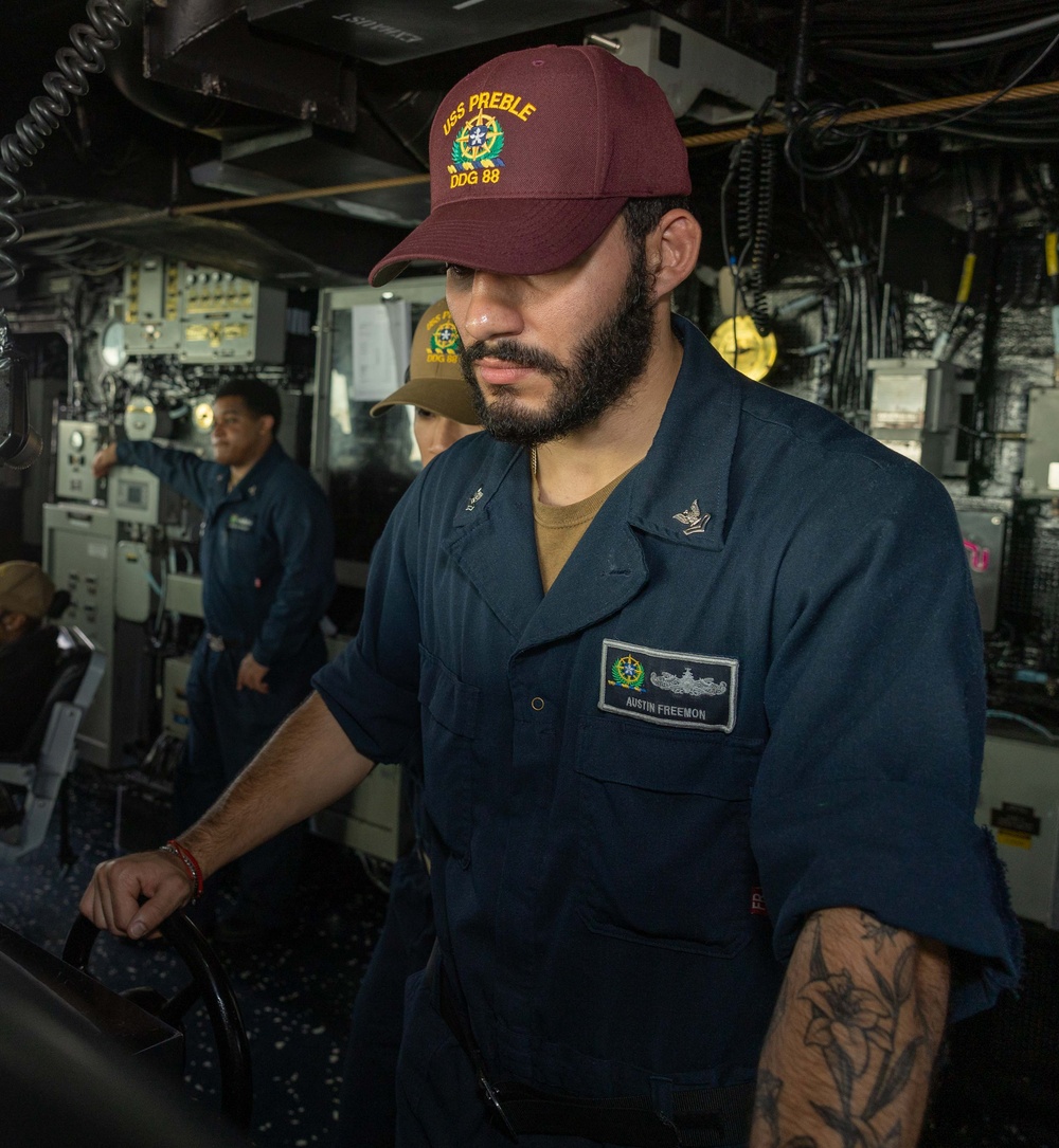 STG2 Austin Freemon Operates Ship's Helm