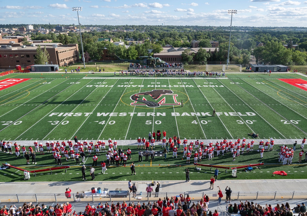 Operation Bosslift: Team Minot kicks off Minot State University football game