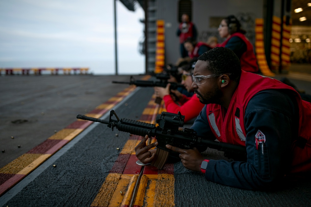 USS Tripoli Sailors Conduct a Weapons Qualification