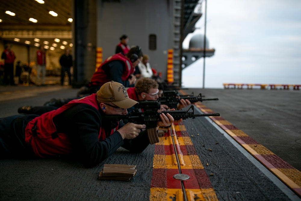 USS Tripoli Sailors Conduct a Weapons Qualification