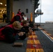 USS Tripoli Sailors Conduct a Weapons Qualification