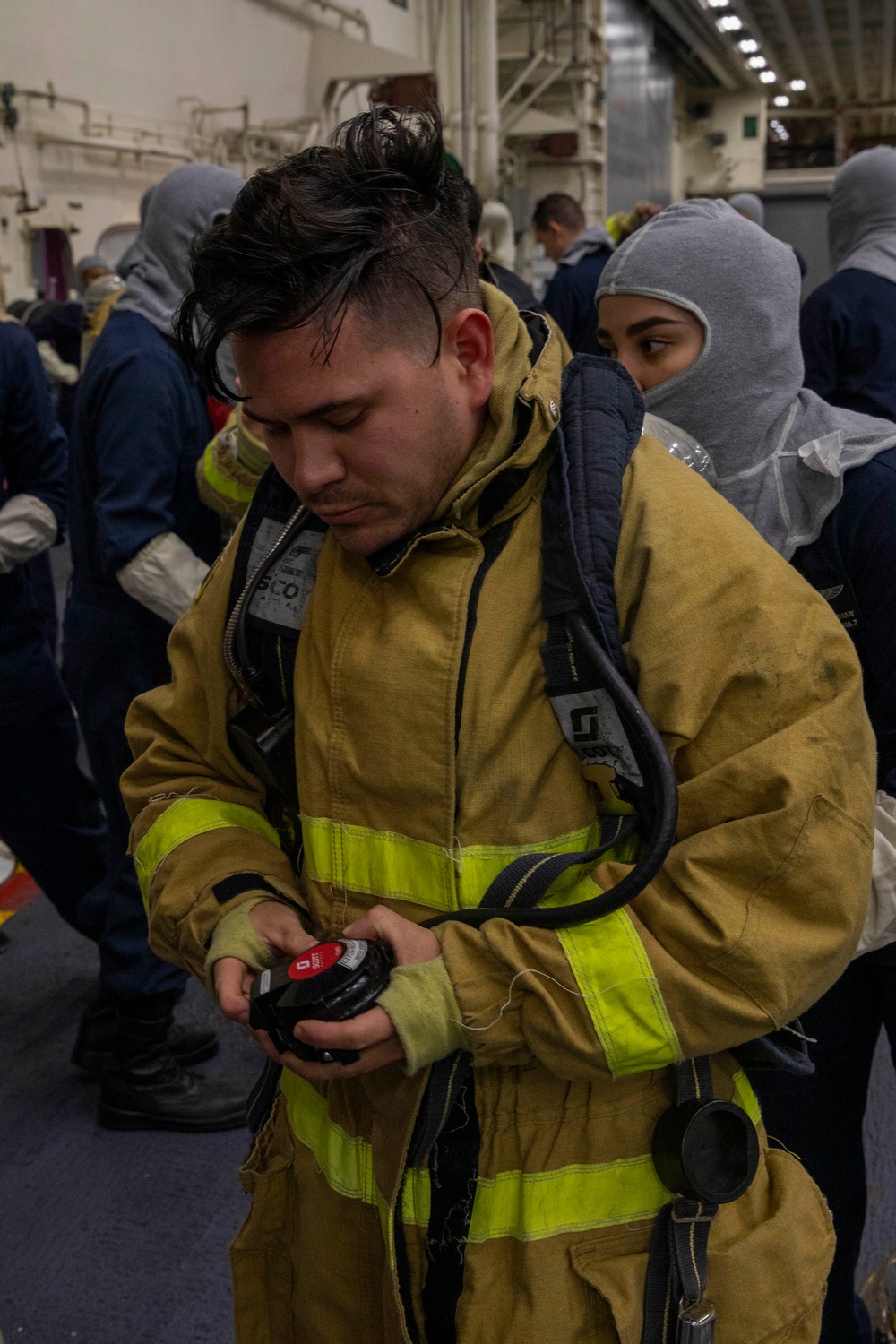 USS Tripoli Sailors Conduct a General Quarters Drill