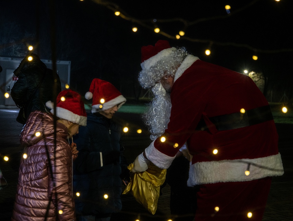 Deployed Soldiers Light Up the Night at Festive Tree Lighting Ceremony