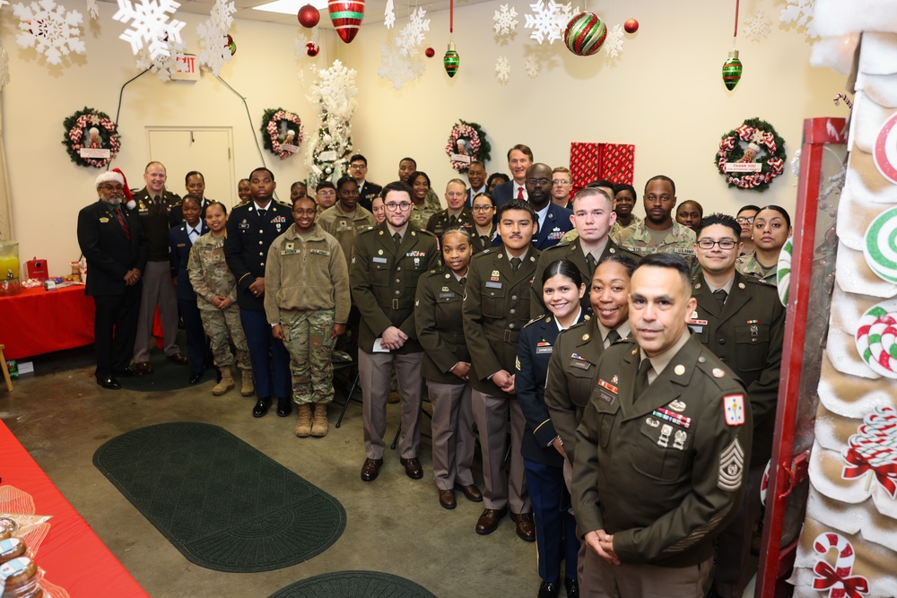 Governor Glenn Youngkin attends Holiday Helper Open House to help bring joy to military families