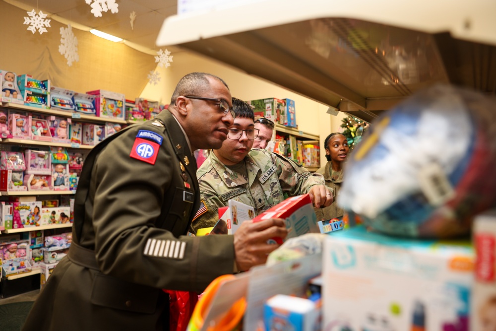 Governor Glenn Youngkin attends Holiday Helper Open House to help bring joy to military families