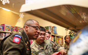 Governor Glenn Youngkin attends Holiday Helper Open House to help bring joy to military families