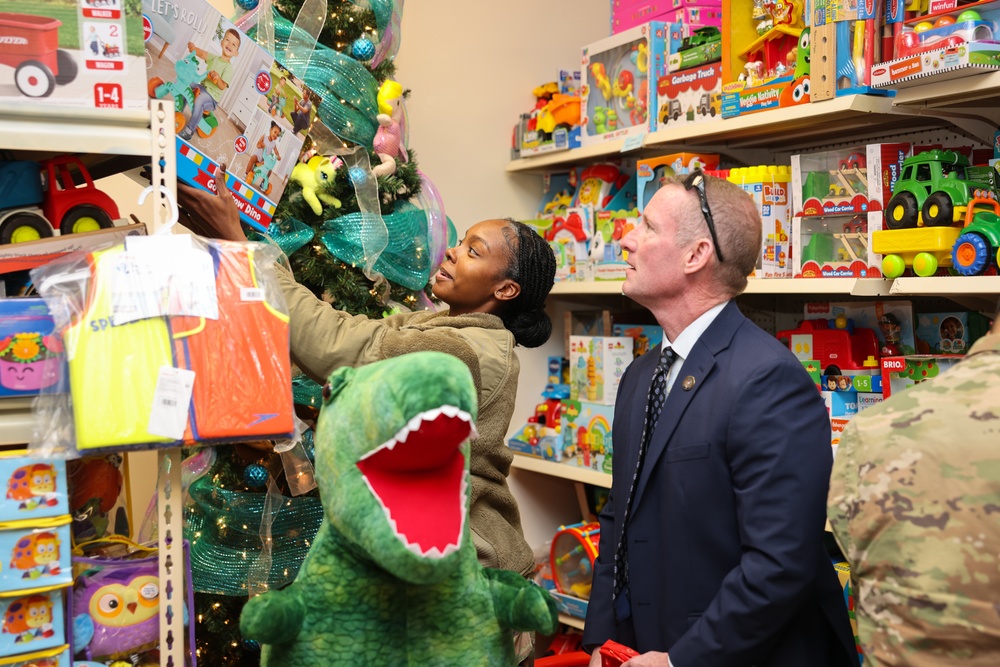 Governor Glenn Youngkin attends Holiday Helper Open House to help bring joy to military families