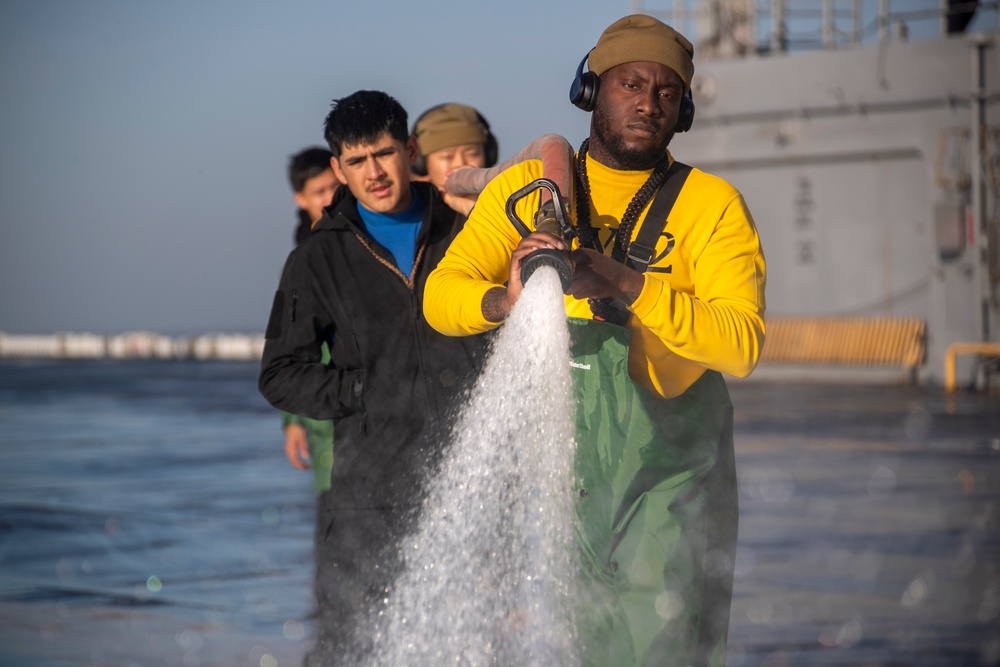 Sailors and Marines Conduct a Fresh Water Wash-Down