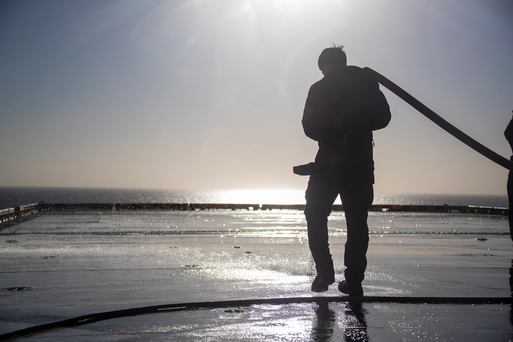 Sailors and Marines Conduct a Fresh Water Wash-Down