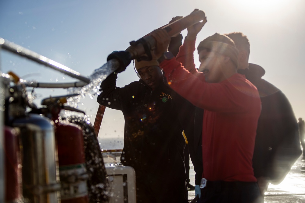 Sailors and Marines Conduct a Fresh Water Wash-Down