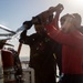 Sailors and Marines Conduct a Fresh Water Wash-Down