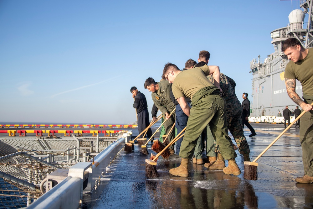 Sailors Conduct a fresh water Wash-down