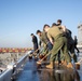 Sailors Conduct a fresh water Wash-down