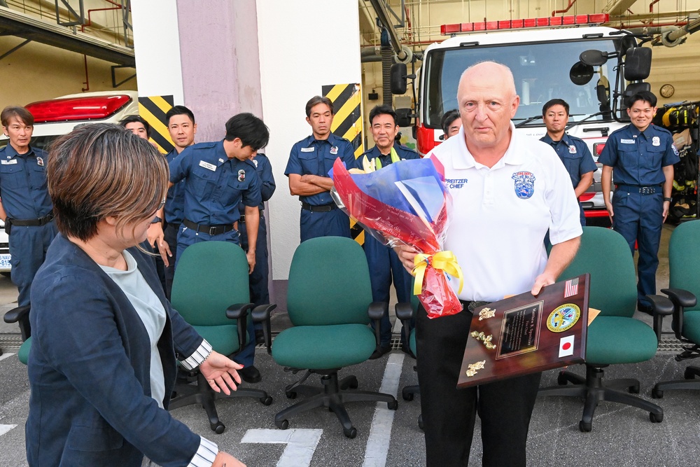 U.S. Army Garrison Okinawa, Matthew Spreitzer, Fire and Emergency Services chief, receives a Farewell