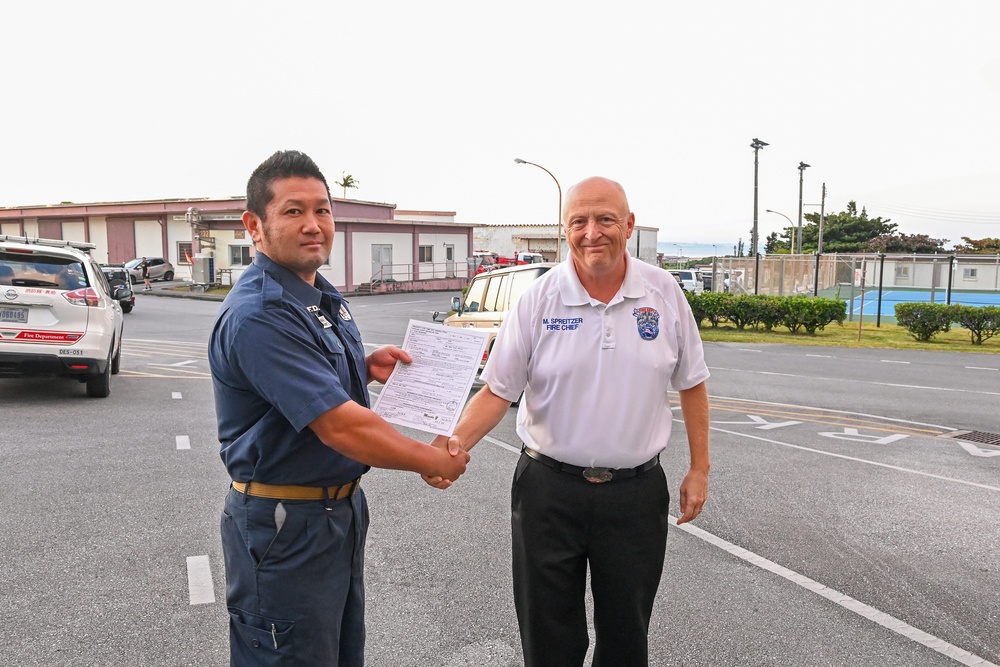 U.S. Army Garrison Okinawa, Matthew Spreitzer, Fire and Emergency Services chief, receives a Farewell