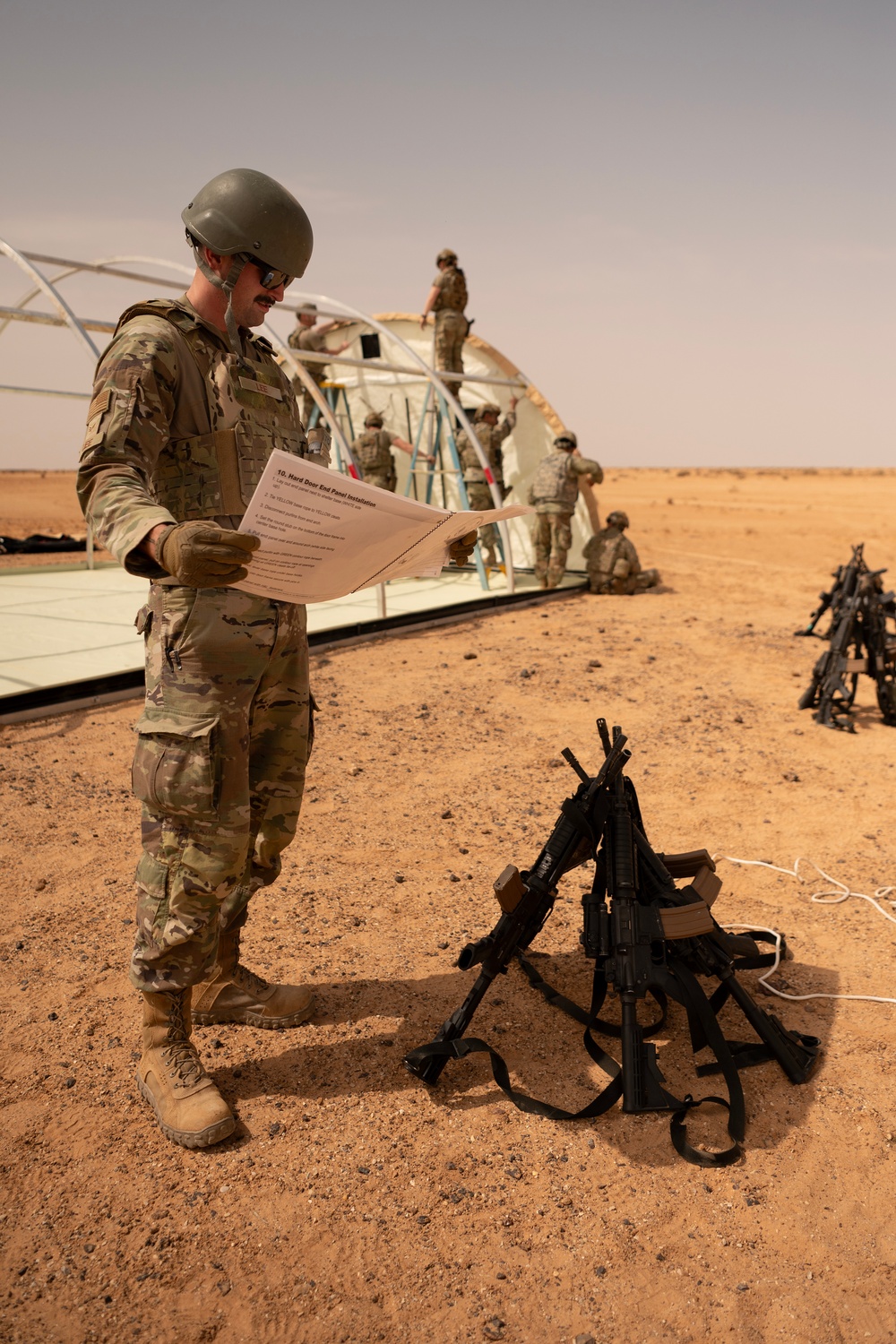 U.S. Airmen build tents during tactical airfield exercise