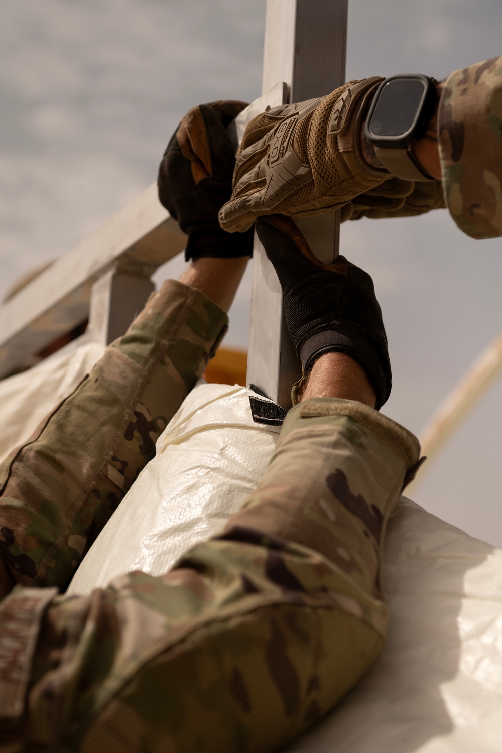 U.S. Airmen build tents during tactical airfield exercise