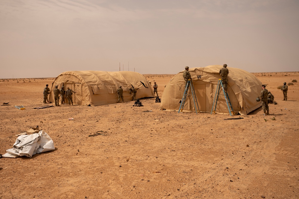 U.S. Airmen build tents during tactical airfield exercise