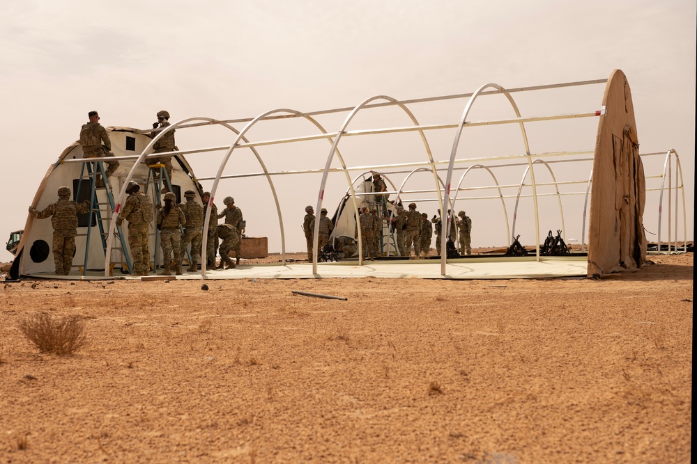 U.S. Airmen build tents during tactical airfield exercise