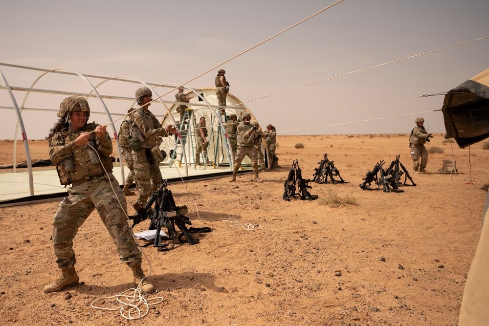 U.S. Airmen build tents during tactical airfield exercise