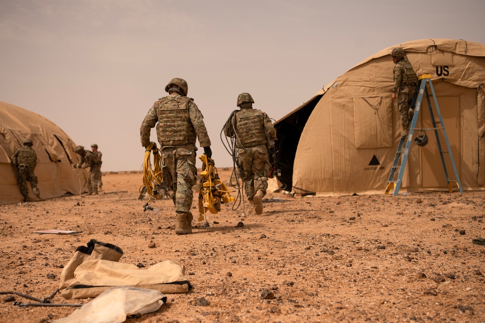 U.S. Airmen build tents during tactical airfield exercise