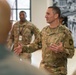 CMSgt. Brian Kruzelnick coins Airmen