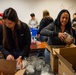 Building holiday magic: Team Travis gears up for Holiday Dorm Drop