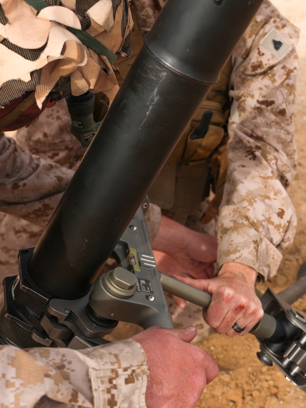 U.S. Marines with 2nd Battalion, 23rd Marine Regiment, fire mortars during training for upcoming deployment