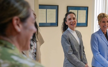 Cindy Wilsbach, wife of U.S. Air Force Gen. Ken Wilsbach, commander of Air Combat Command and Dr. Doniel Wolfe, wife of Chief Master Sgt. Dave Wolfe, ACC command chief, share a lighthearted moment with 78th Medical Group.