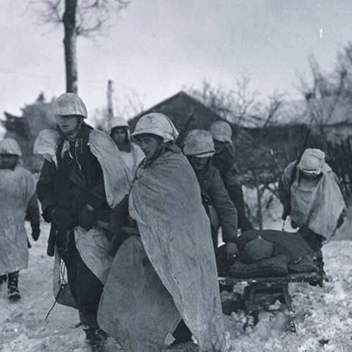 Army Paratroopers in WW II Battle of the Bulge Drag Wounded Buddy to Aid