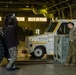 Japanese forces assist U.S. Marines with transporting equipment