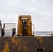 USS Ronald Reagan (CVN 76) Sailors transport gear on the flight deck