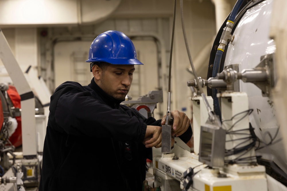 USS Gerald R. Ford (CVN 78) Sailor conducts engine maintenance