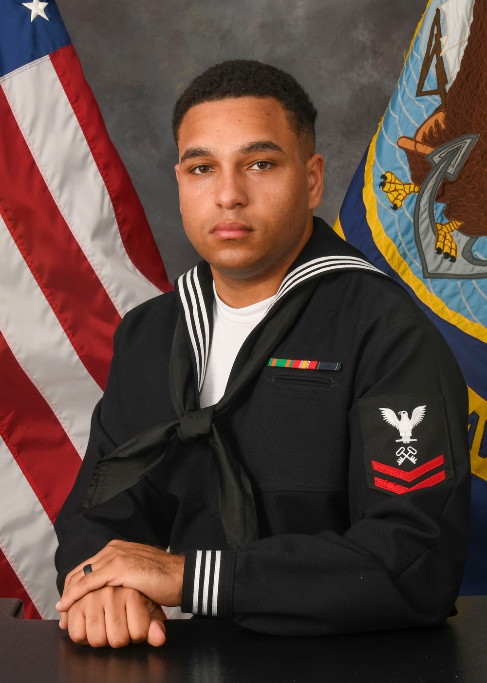 Logistics Specialist Petty Officer 2nd Class Trynlon Gregory official photo