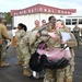 Returning deployers are welcomed home by friends and family